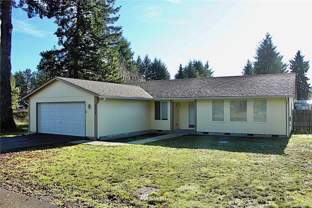 9836 179th Way Southwest Rochester, WA 98579 - Photo 2 of 26 a front view of a house with a yard