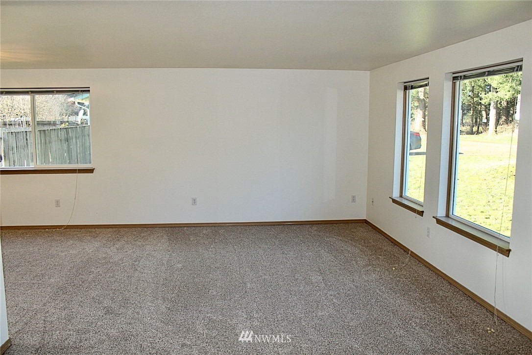 9836 179th Way Southwest Rochester, WA 98579 - Photo 11 of 26 an empty room with windows
