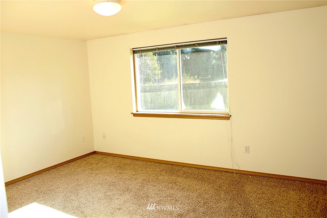 9836 179th Way Southwest Rochester, WA 98579 - Photo 14 of 26 an empty room with a window