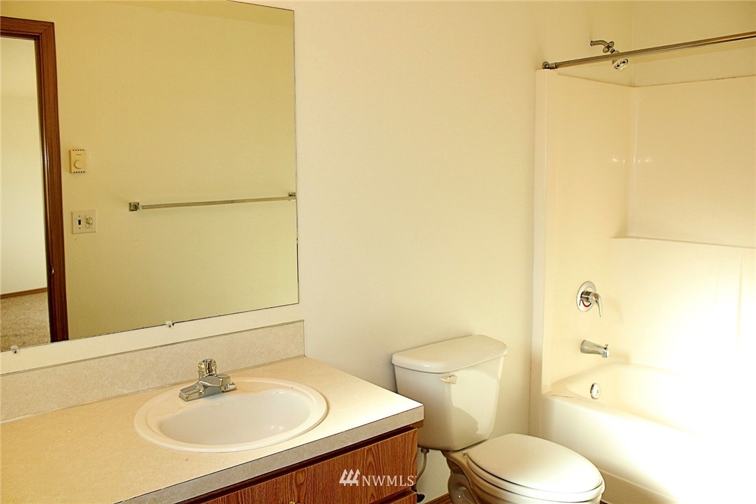 9836 179th Way Southwest Rochester, WA 98579 - Photo 15 of 26 a bathroom with a sink toilet and shower