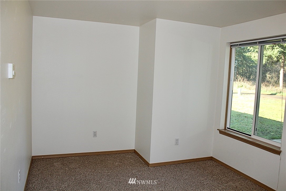 9836 179th Way Southwest Rochester, WA 98579 - Photo 17 of 26 an empty room with windows