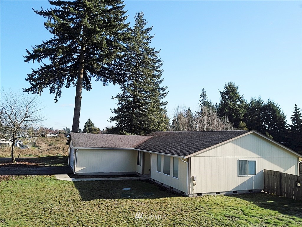 9836 179th Way Southwest Rochester, WA 98579 - Photo 22 of 26 a view of a house with a yard