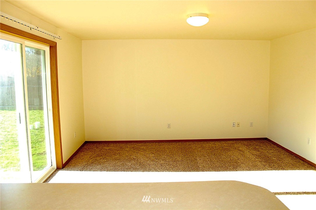 9836 179th Way Southwest Rochester, WA 98579 - Photo 8 of 26 a view of an empty room and window
