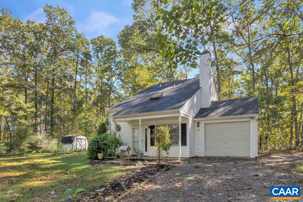 140 Tulip Road Ruckersville, VA 22968 - Photo 1 of 42 a front view of a house with a garden