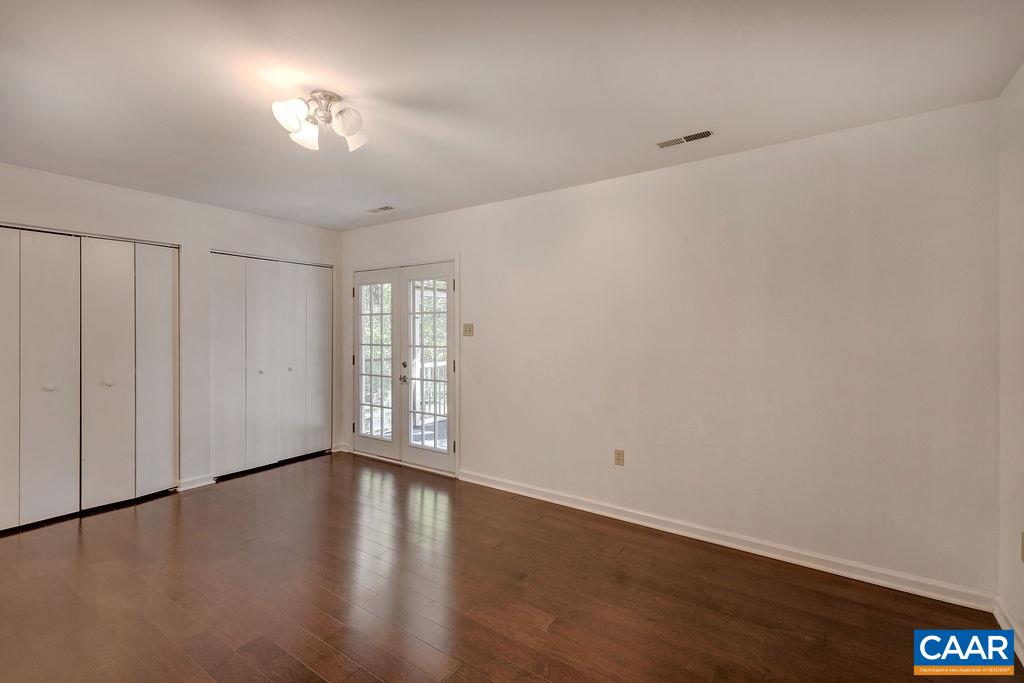 140 Tulip Road Ruckersville, VA 22968 - Photo 13 of 42 a view of an empty room with wooden floor and a window