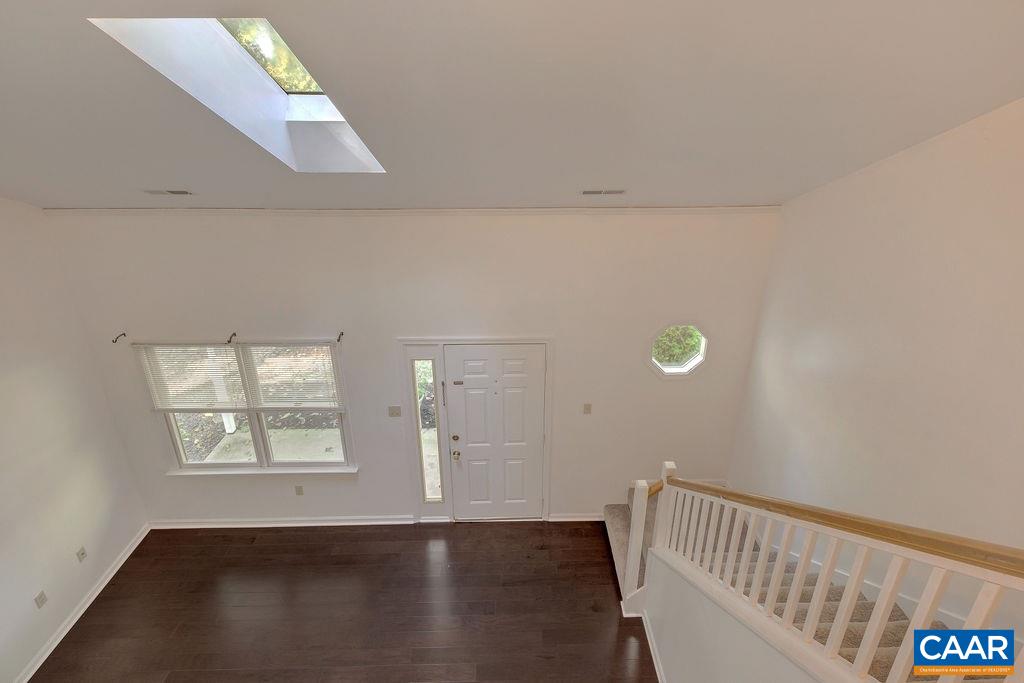 140 Tulip Road Ruckersville, VA 22968 - Photo 18 of 42 a view of an empty room with wooden floor and a window