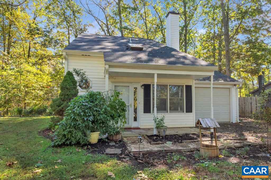 140 Tulip Road Ruckersville, VA 22968 - Photo 2 of 42 a front view of a house with a garden and yard