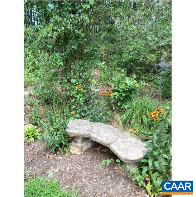 140 Tulip Road Ruckersville, VA 22968 - Photo 33 of 42 a backyard of a house with outdoor seating and green space