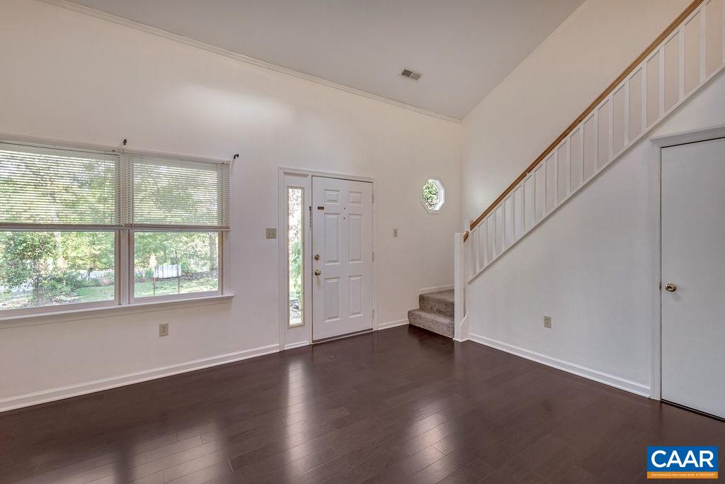 140 Tulip Road Ruckersville, VA 22968 - Photo 5 of 42 an empty room with wooden floor and windows