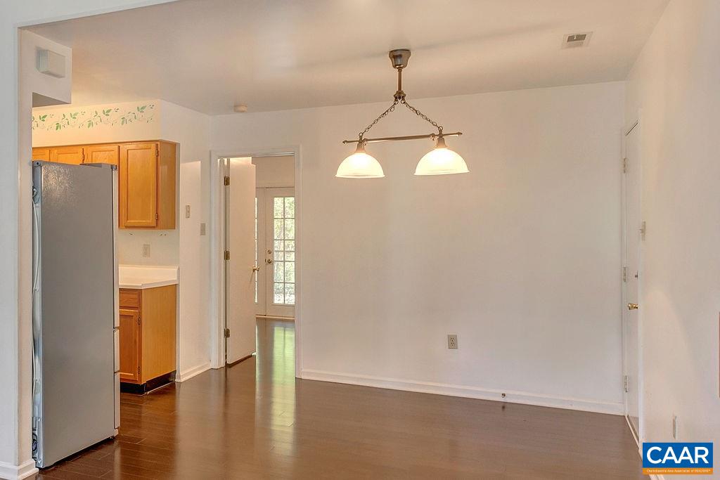 140 Tulip Road Ruckersville, VA 22968 - Photo 8 of 42 a view of a hallway with wooden floor