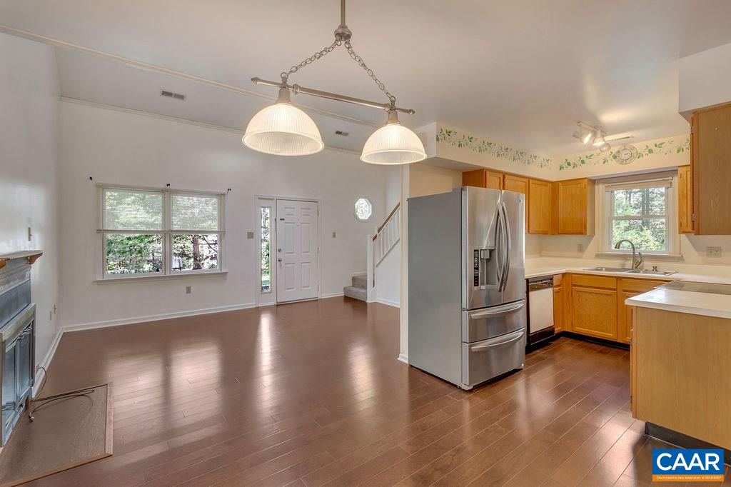 140 Tulip Road Ruckersville, VA 22968 - Photo 9 of 42 a view of a kitchen center island wooden floor and windows