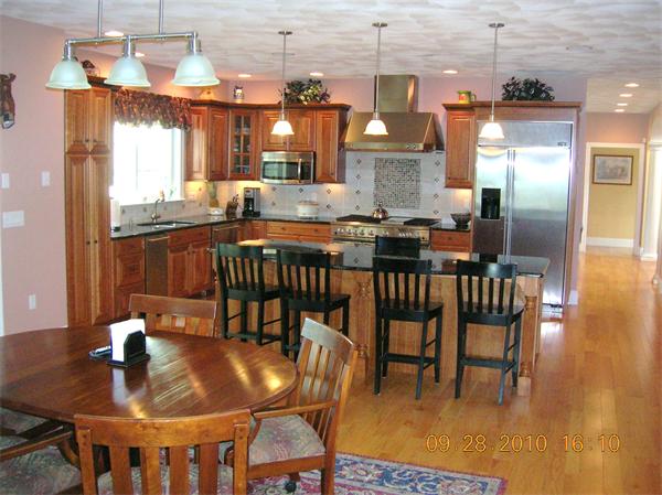 115 Carter Field Road North Andover, MA 01845 - Photo 11 of 13 a view of a dining room with furniture and wooden floor