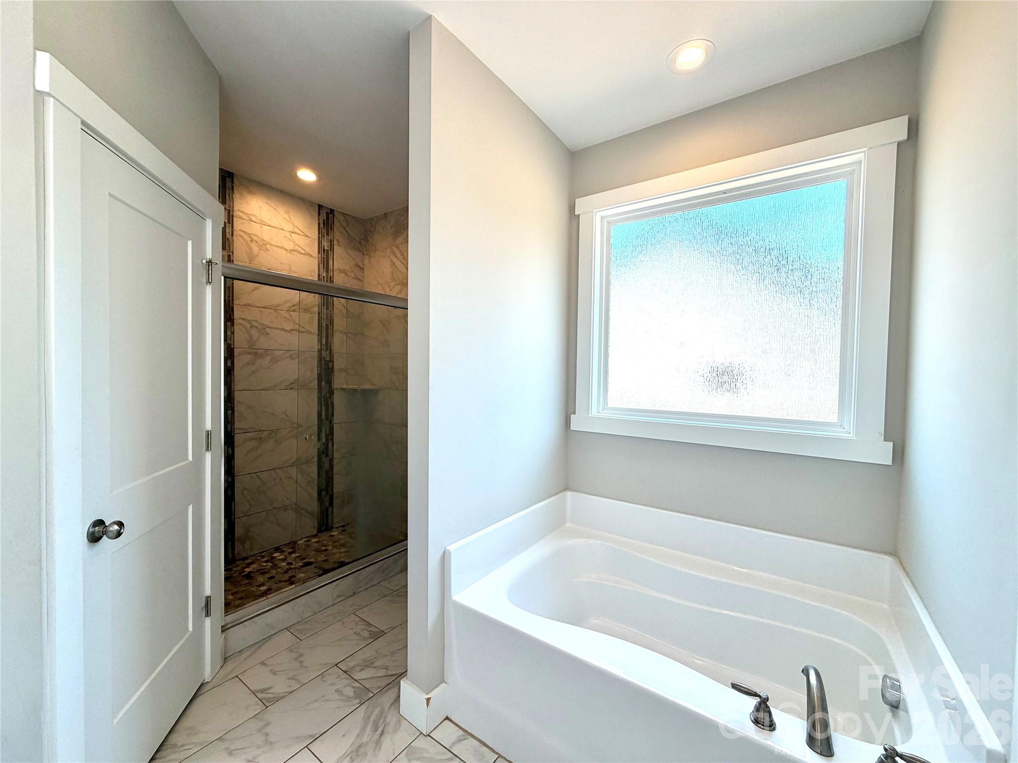 1473 Pleasant School Road Gaffney, SC 29341 - Photo 13 of 16 a bathroom with a bathtub and shower
