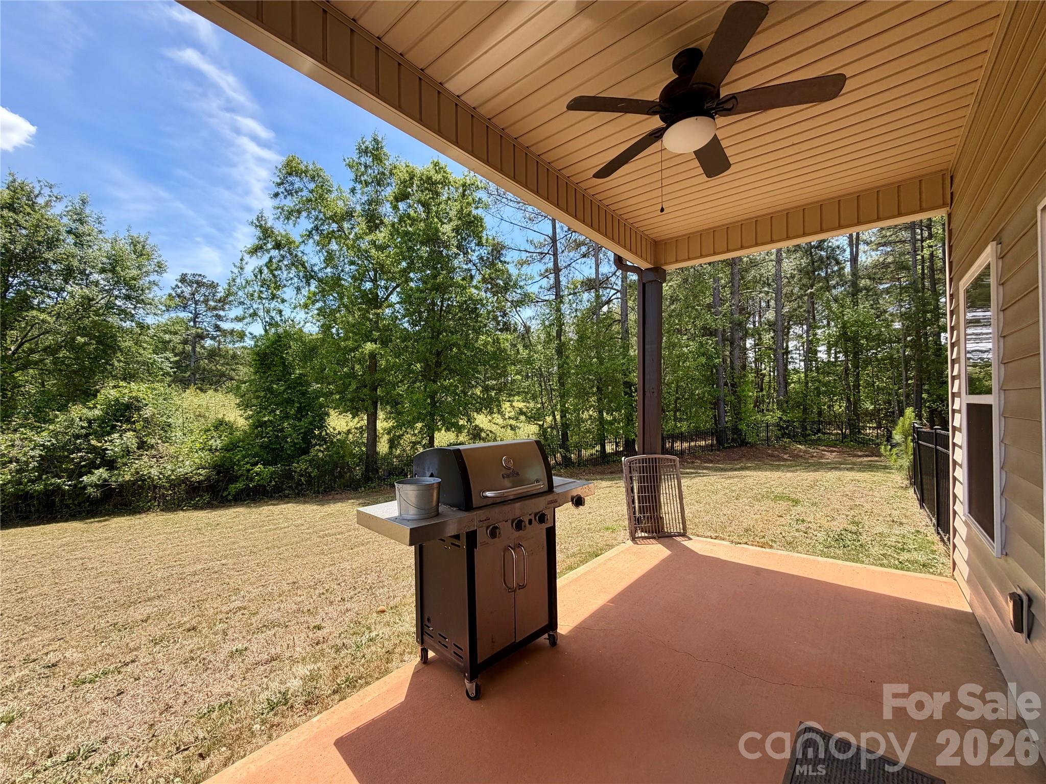 1473 Pleasant School Road Gaffney, SC 29341 - Photo 3 of 16 a view of a backyard with wooden fence