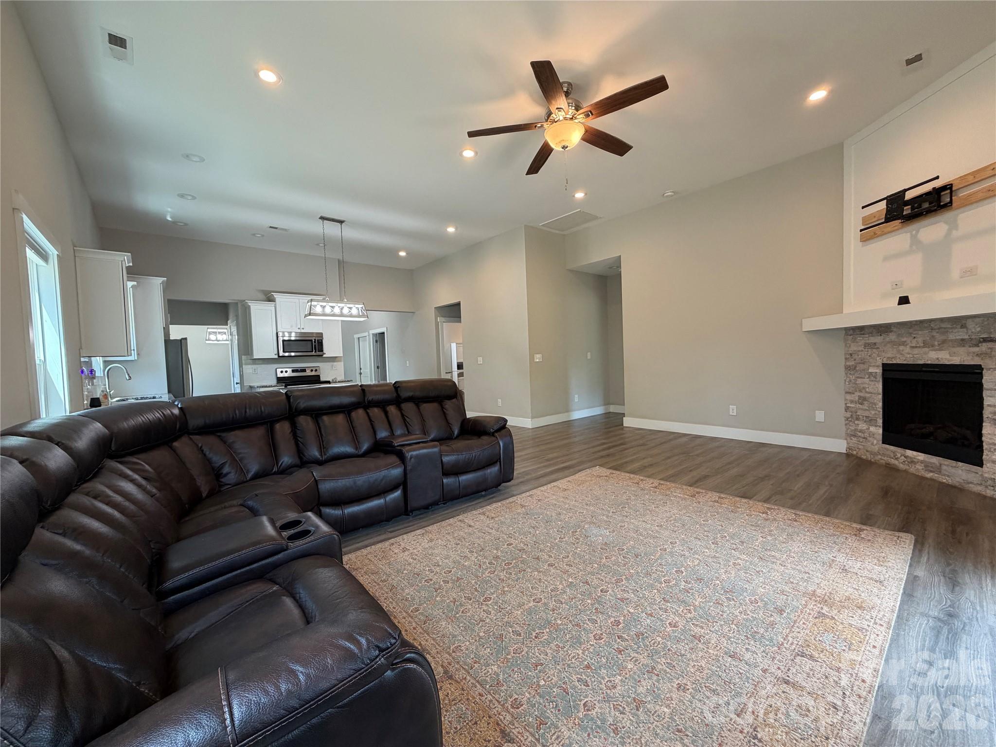 1473 Pleasant School Road Gaffney, SC 29341 - Photo 10 of 16 a living room with furniture and a fireplace