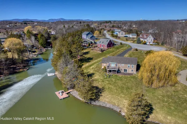 an aerial view of residential houses with outdoor space