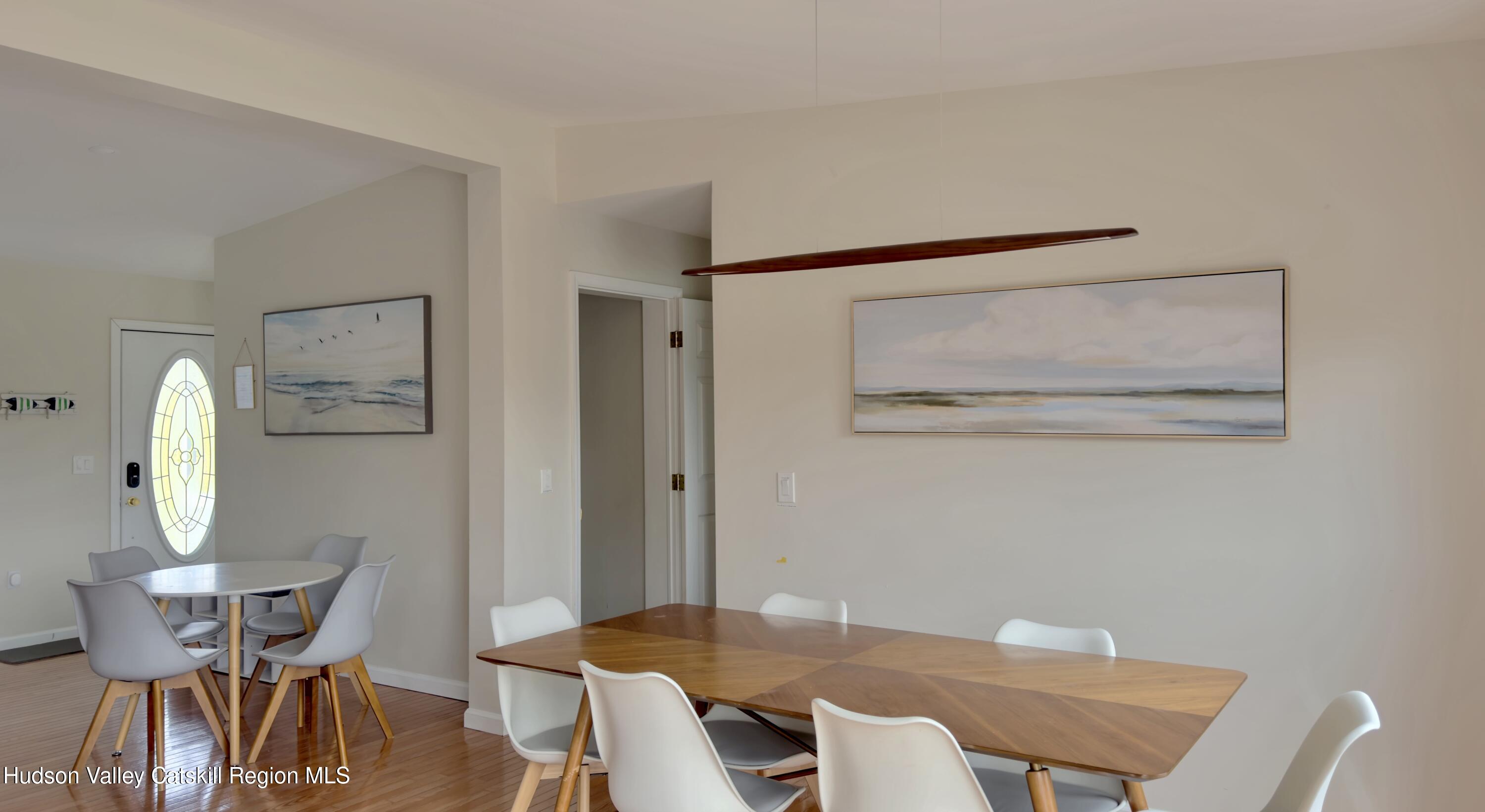 70 Travis Place Athens, NY 12015 - Photo 12 of 57 a view of a dining room with furniture and wooden floor