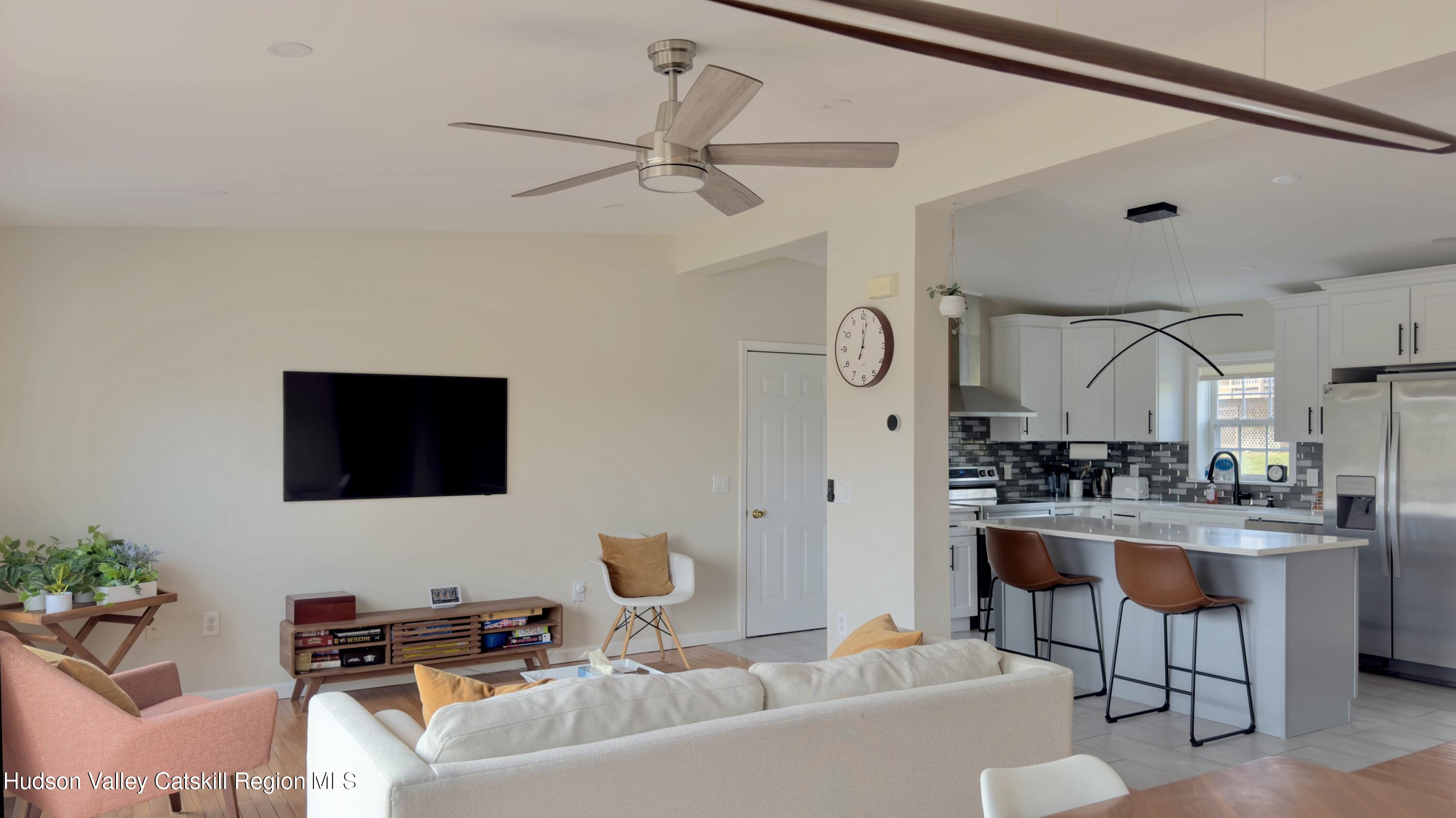 70 Travis Place Athens, NY 12015 - Photo 13 of 57 a living room with furniture and a flat screen tv