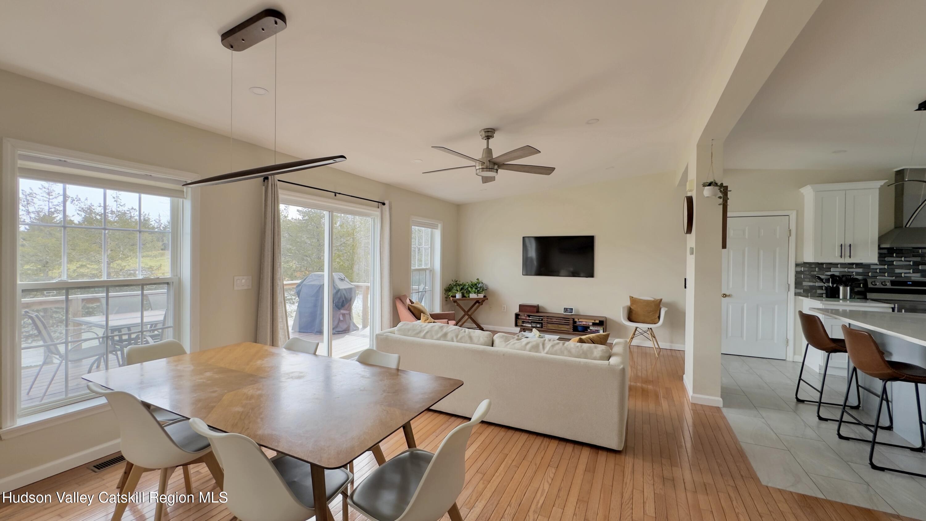 70 Travis Place Athens, NY 12015 - Photo 17 of 57 a view of a dining room with furniture window and wooden floor