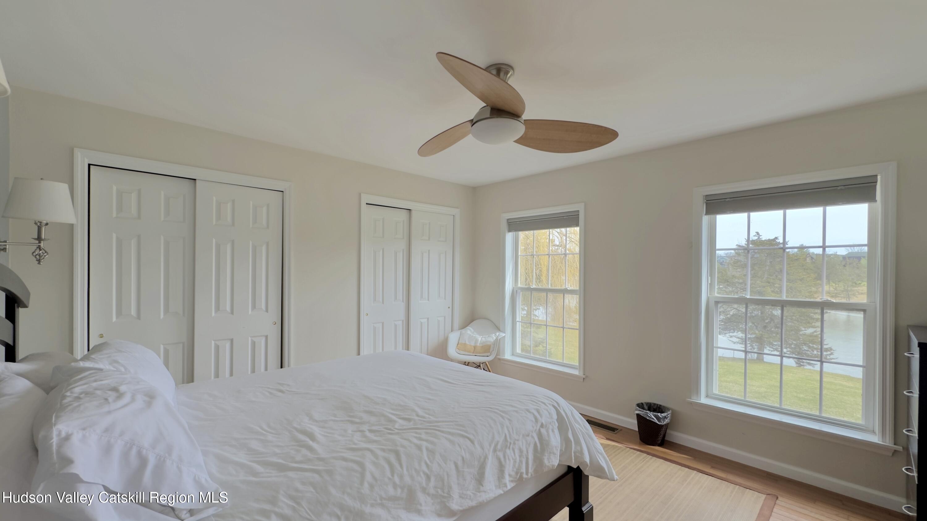 70 Travis Place Athens, NY 12015 - Photo 19 of 57 a bedroom with a large bed and a large window