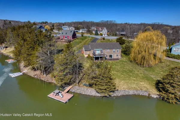 a aerial view of a house with a big yard