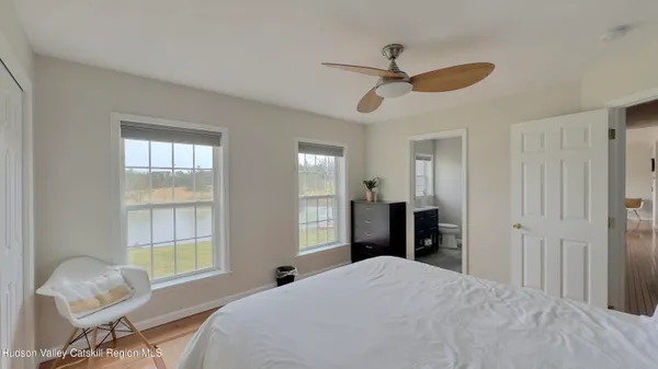 a view of a lake with houses in the back