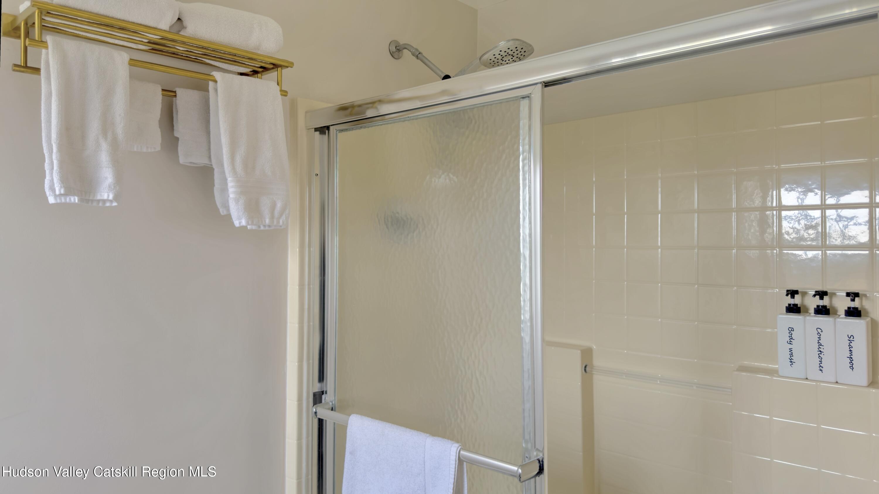 70 Travis Place Athens, NY 12015 - Photo 25 of 57 a bathroom with a shower and a glass door