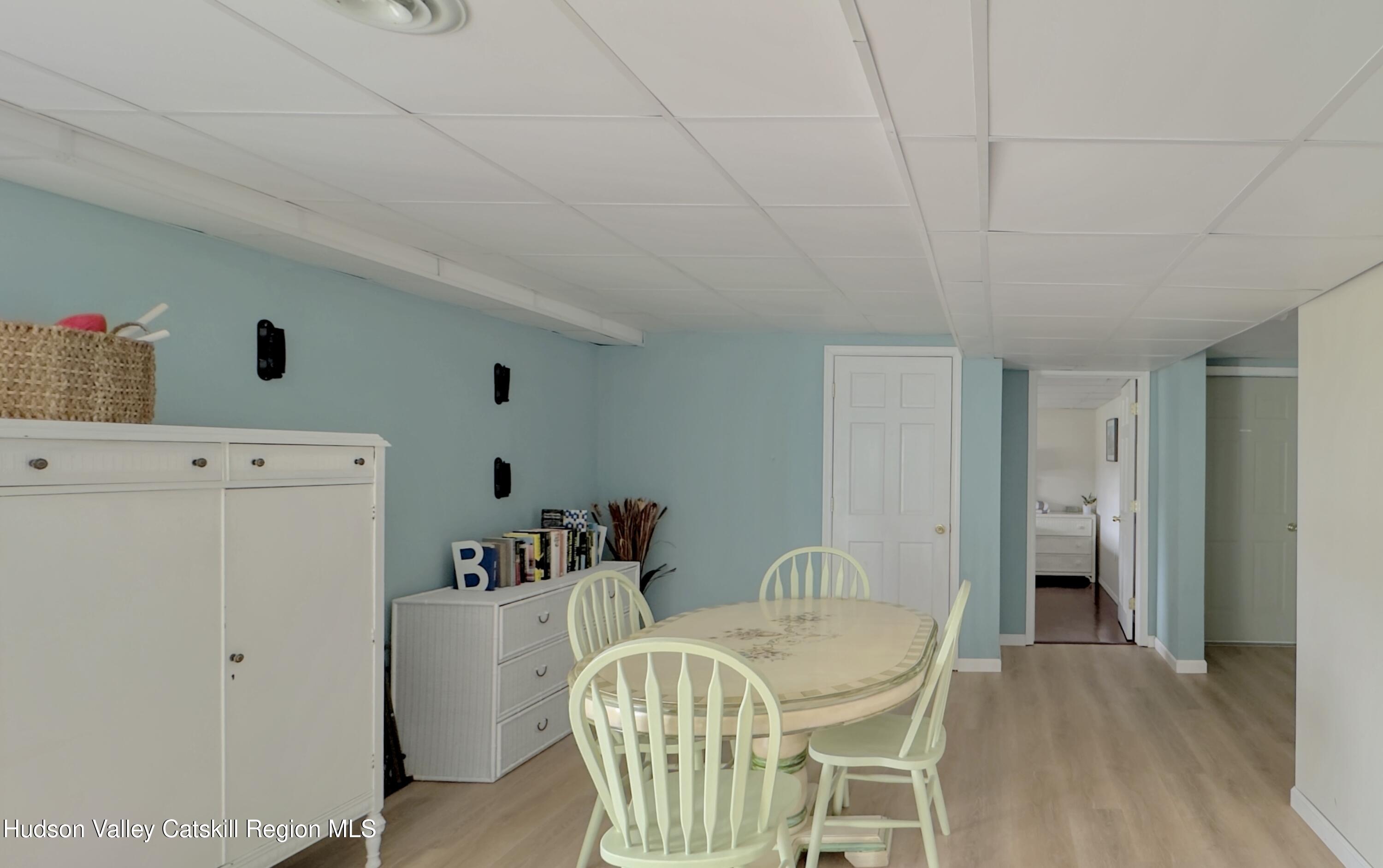 70 Travis Place Athens, NY 12015 - Photo 39 of 57 a dining room with furniture and wooden floor