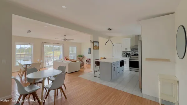 a view of a dining room with furniture and wooden floor