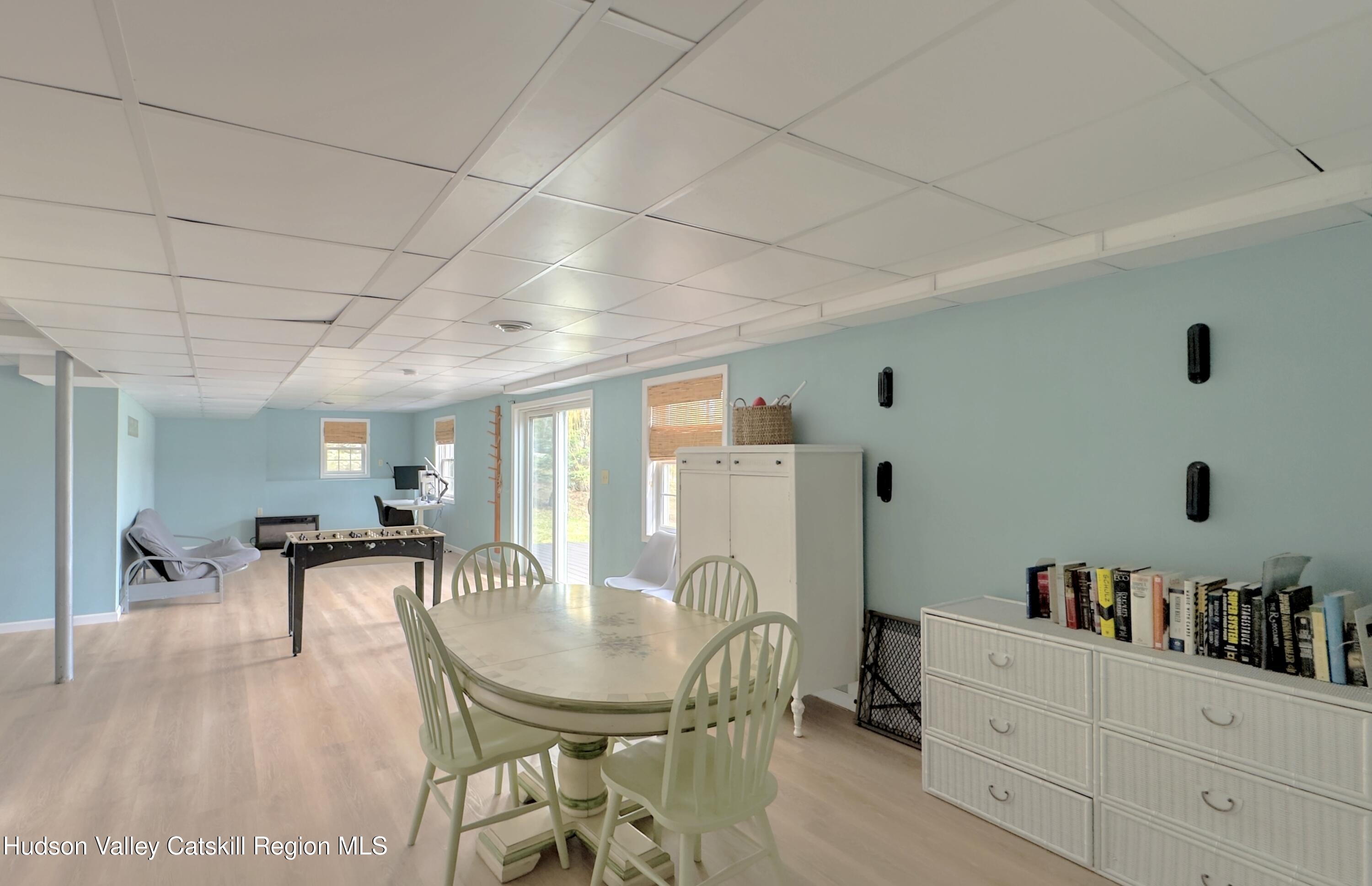 70 Travis Place Athens, NY 12015 - Photo 42 of 57 a dining room with furniture and a chandelier