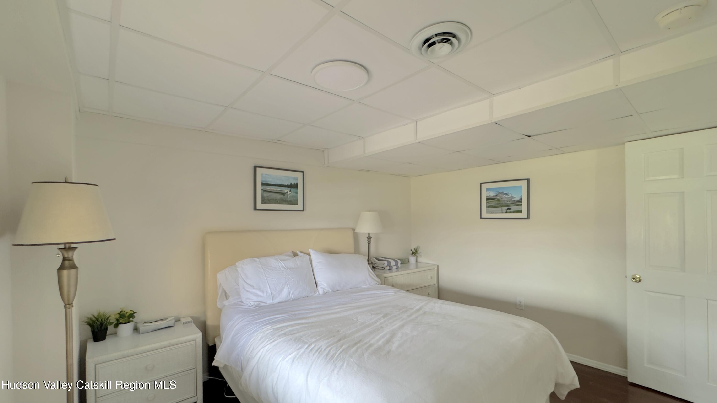 70 Travis Place Athens, NY 12015 - Photo 43 of 57 a bedroom with a bed and a night stand