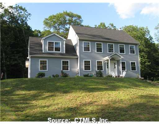 239 Baxter Road Mansfield, CT 06268 - Photo 1 of 1 a view of a yard in front of a house with large windows