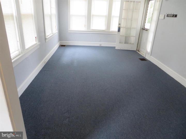 703 Willitts Avenue Audubon, NJ 08106 - Photo 4 of 6 an empty room with windows