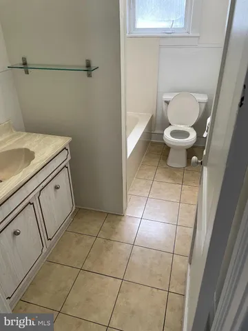 a bathroom with a toilet and a sink
