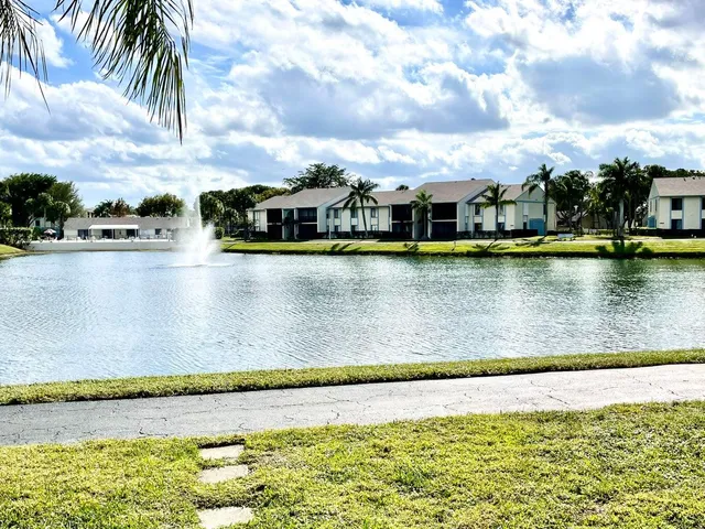 a view of a swimming pool and a chair