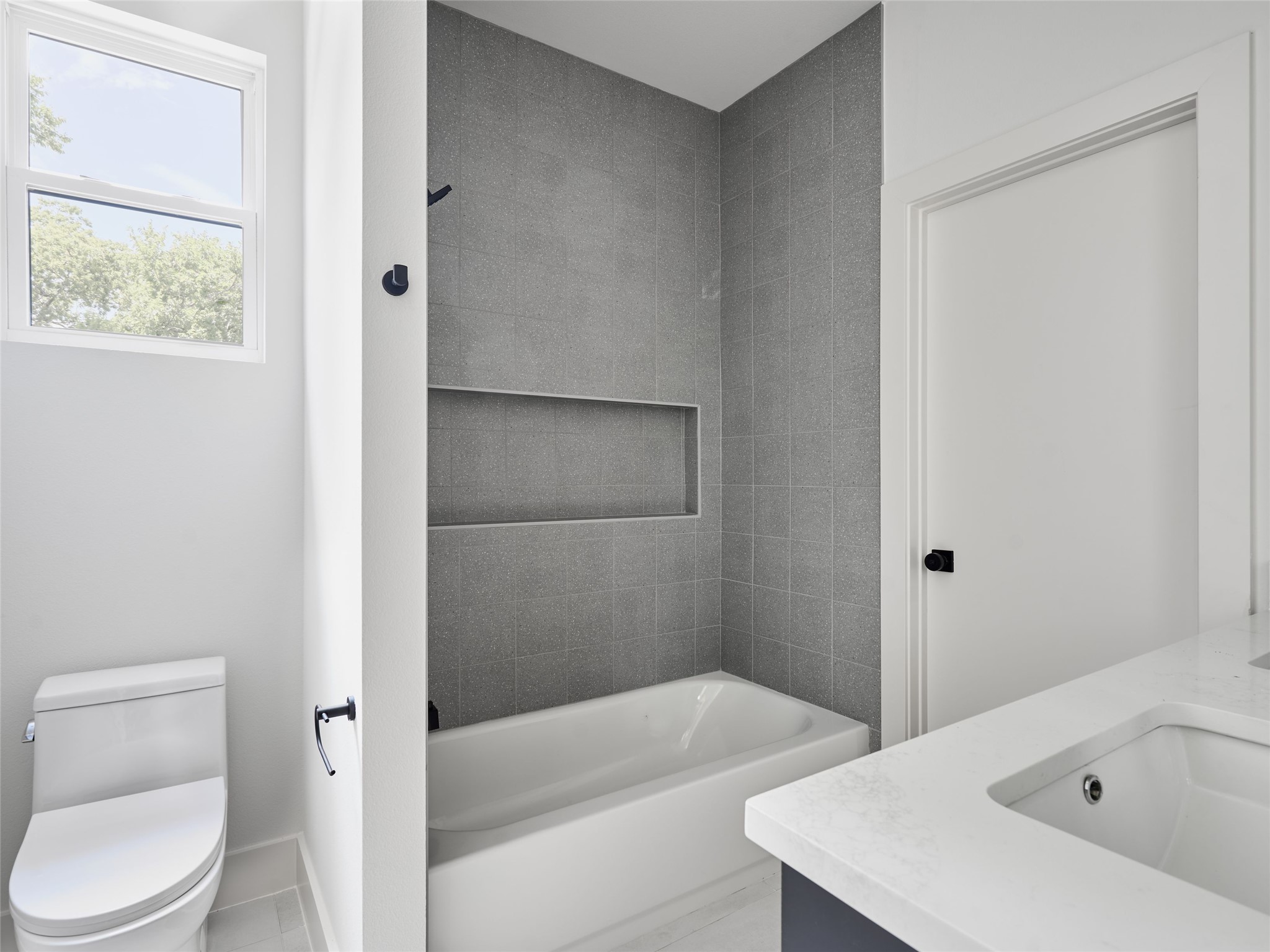 412 Hackberry Lane, Unit 2 Austin, TX 78753 - Photo 23 of 40 Full bathroom with vanity and shower combination