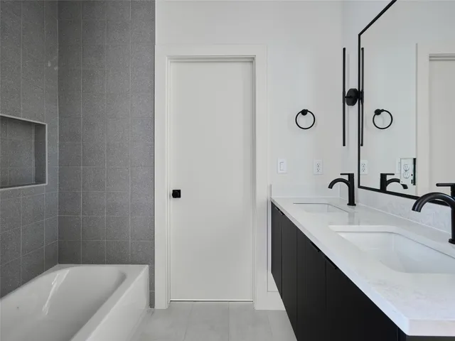 a bathroom with a bathtub and toilet