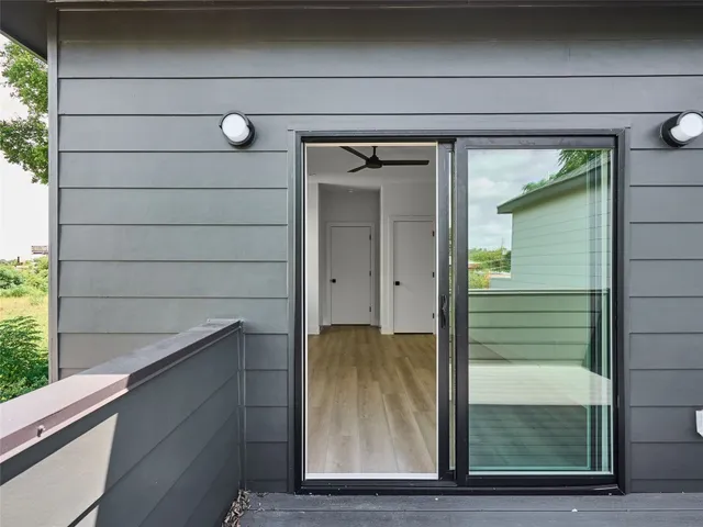 a view of balcony with furniture and wooden floor