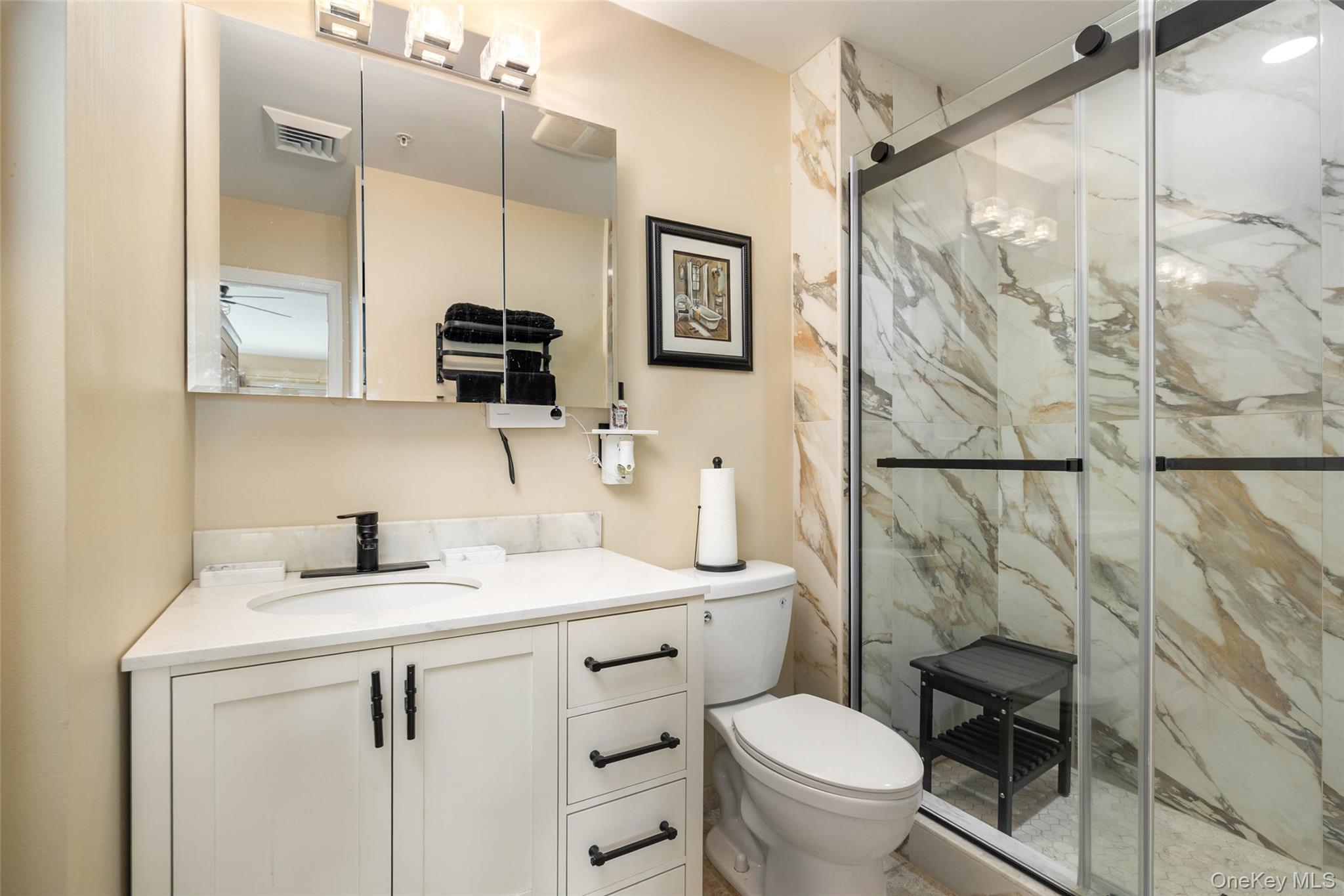 121 Willow Lane Valley Stream, NY 11580 - Photo 18 of 30 Full bath featuring a marble finish shower and vanity