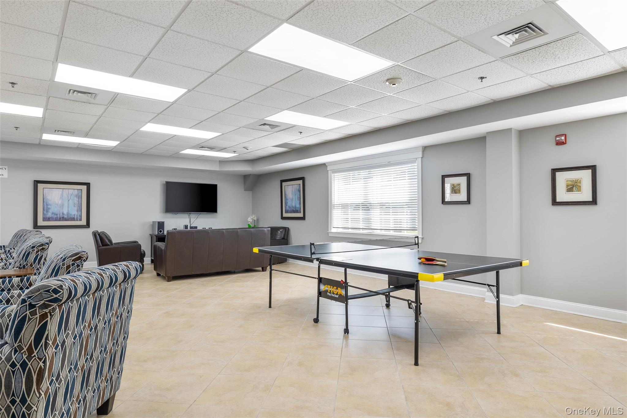 121 Willow Lane Valley Stream, NY 11580 - Photo 28 of 30 Recreation room with a paneled ceiling and light tile patterned floors