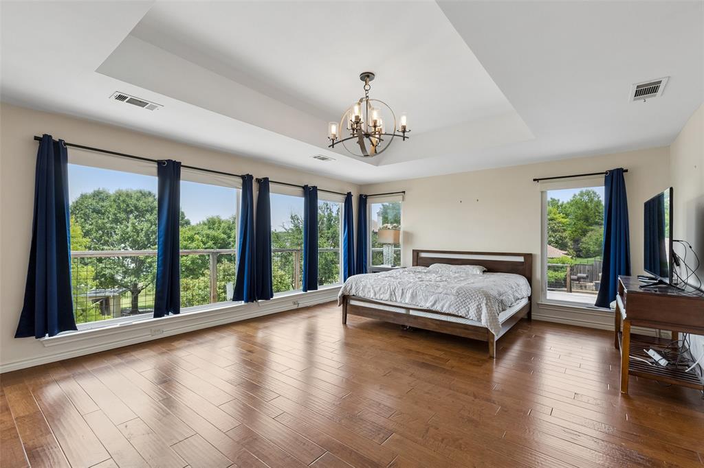 4 Eastshore Road Heath, TX 75032 - Photo 28 of 37 a spacious bedroom with a large bed and a large window