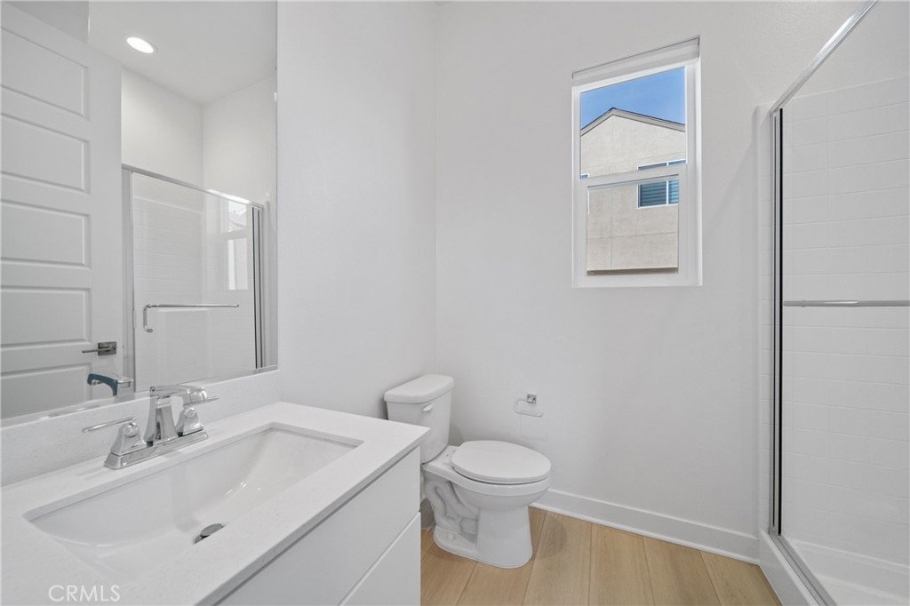 187 Yugen Irvine, CA 92618 - Photo 11 of 31 a bathroom with a sink toilet and vanity