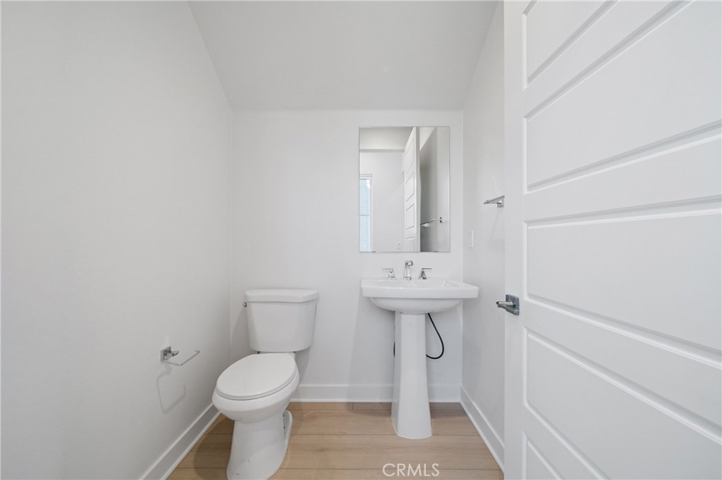 187 Yugen Irvine, CA 92618 - Photo 12 of 31 a bathroom with a toilet sink and mirror