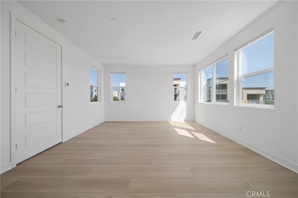 187 Yugen Irvine, CA 92618 - Photo 17 of 31 a view of an empty room with glass door