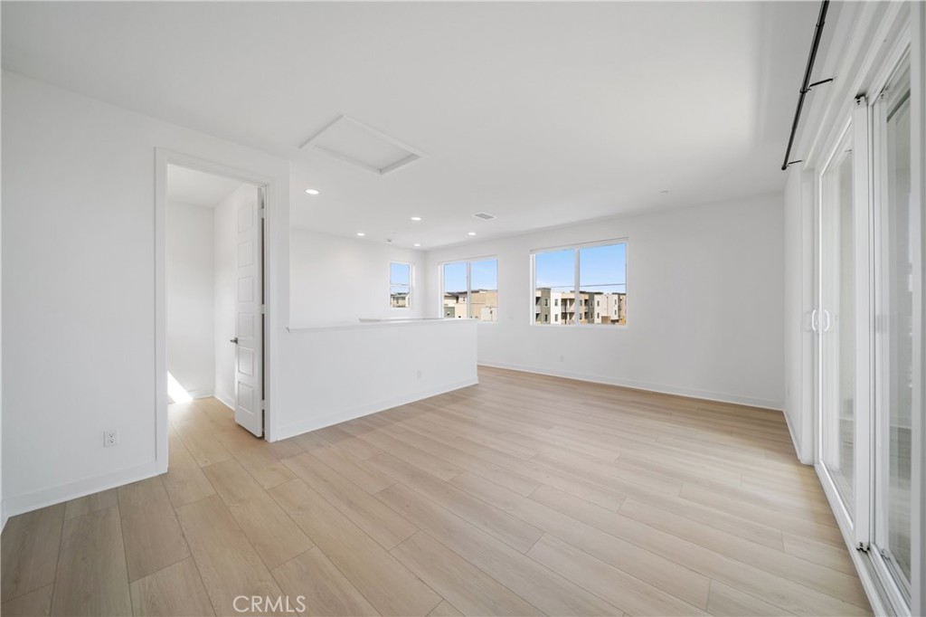 187 Yugen Irvine, CA 92618 - Photo 23 of 31 wooden floor in an empty room with a window