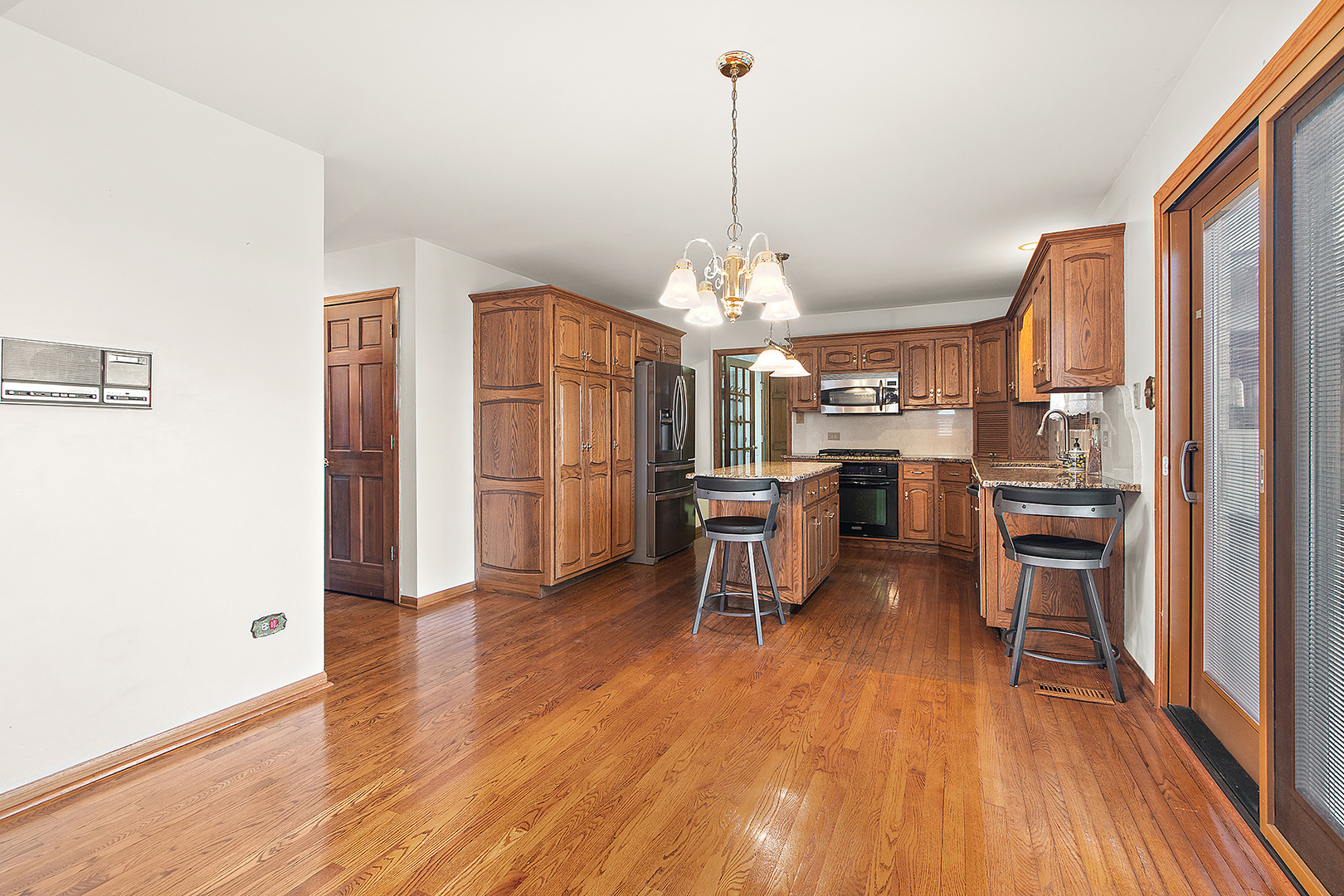 16221 Kingsport Road Orland Park, IL 60467 - Photo 18 of 58 a view of a dining room with furniture window and wooden floor