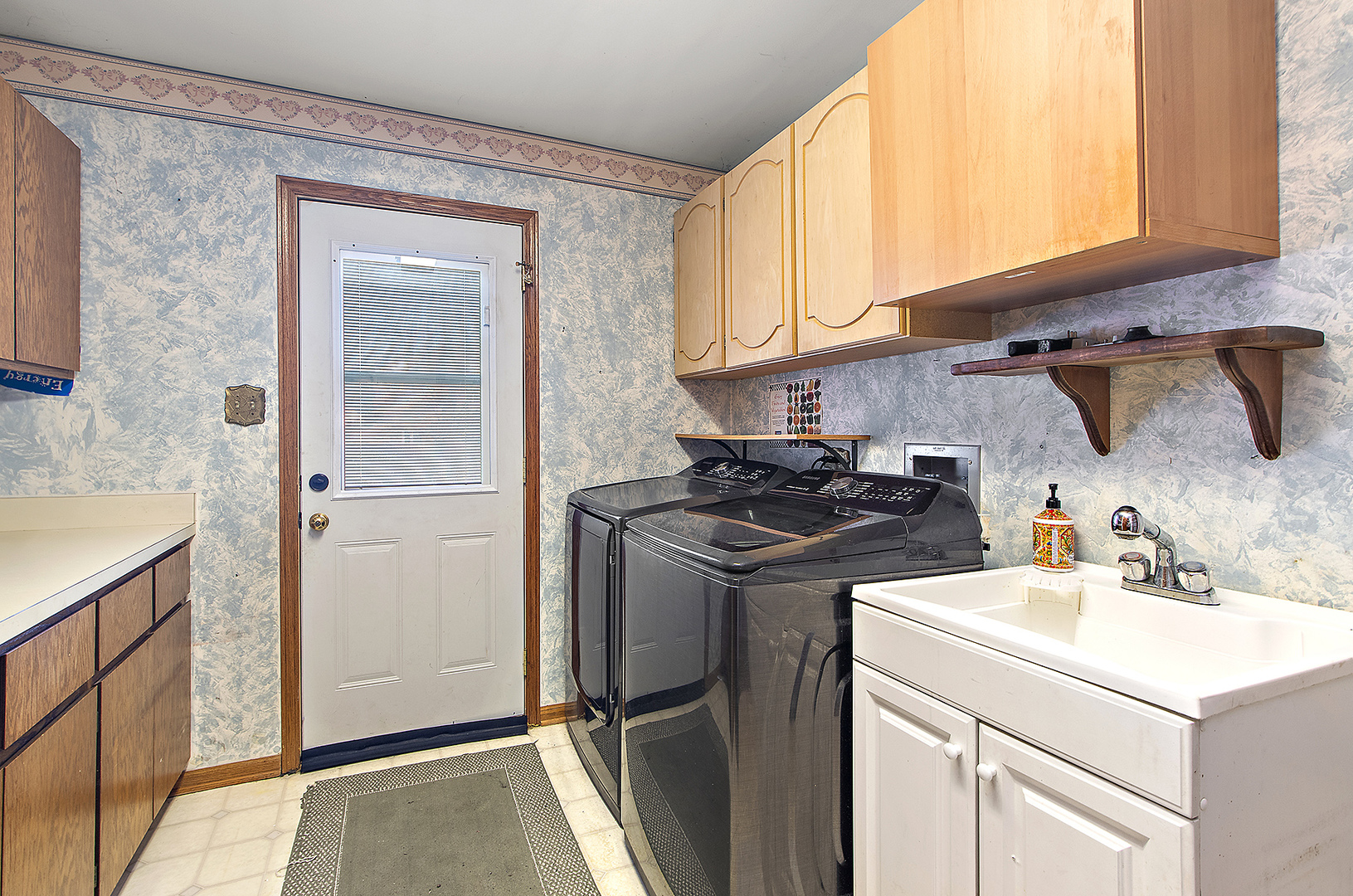 16221 Kingsport Road Orland Park, IL 60467 - Photo 23 of 58 a kitchen with a sink cabinets and stainless steel appliances