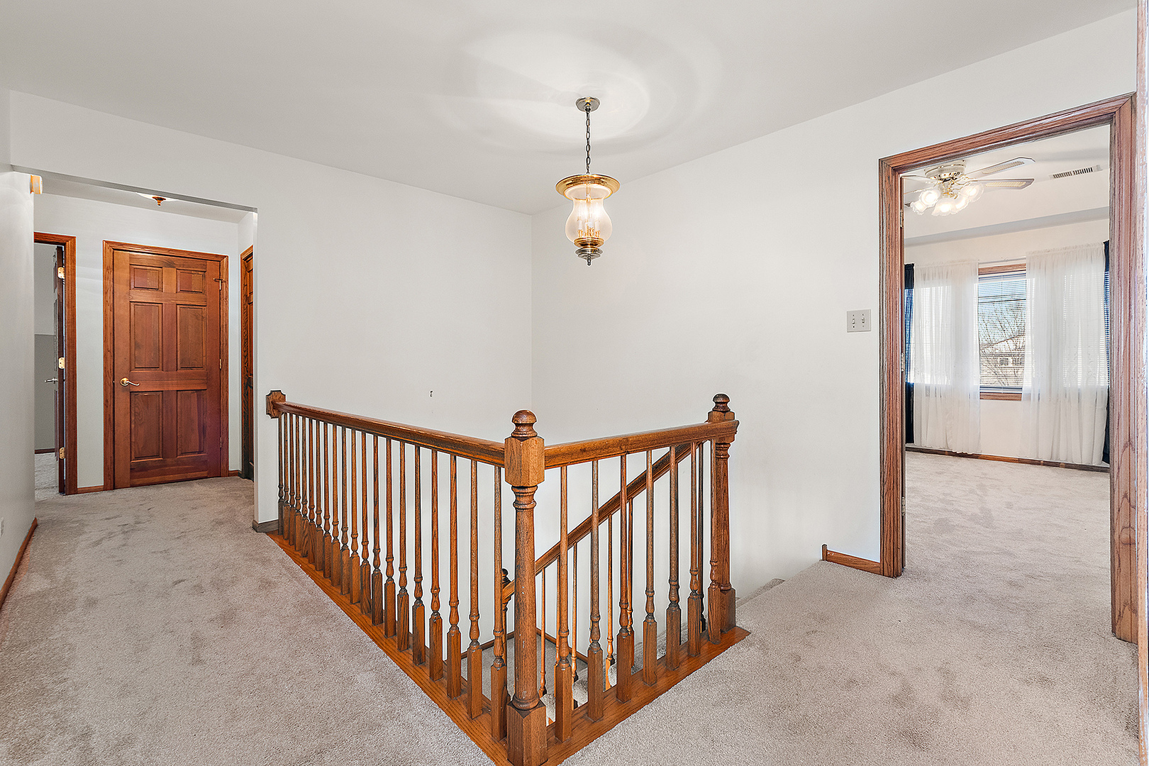 16221 Kingsport Road Orland Park, IL 60467 - Photo 25 of 58 a view of a hallway with wooden floor and stairs
