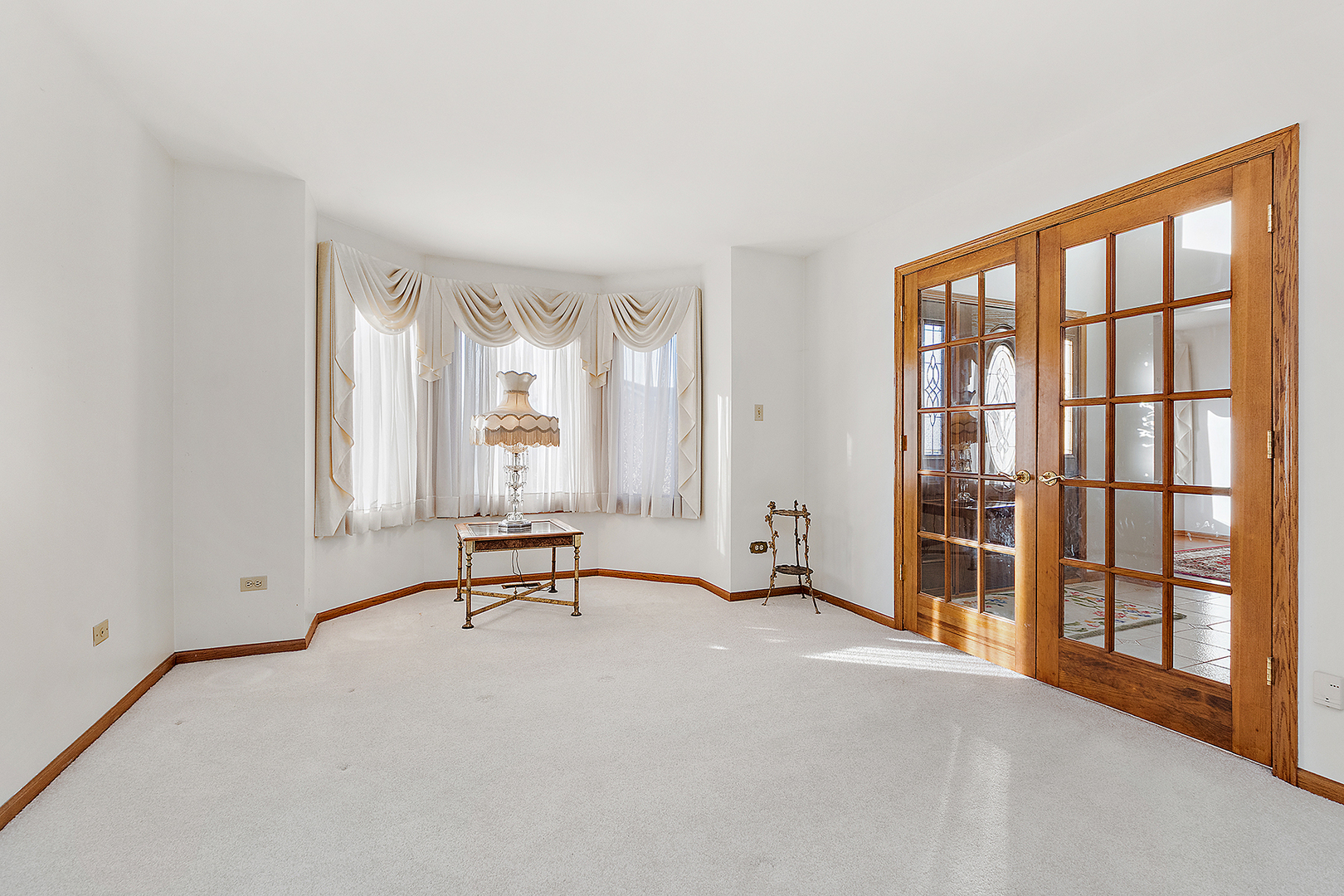 16221 Kingsport Road Orland Park, IL 60467 - Photo 7 of 58 a view of an empty room with windows