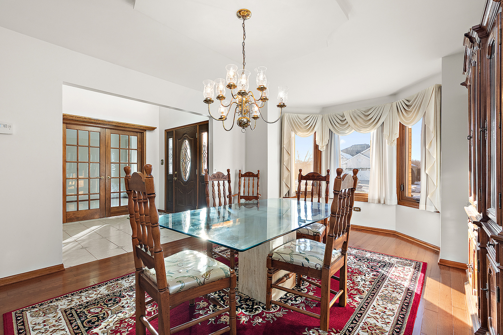 16221 Kingsport Road Orland Park, IL 60467 - Photo 9 of 58 a view of a dining room with furniture window and wooden floor